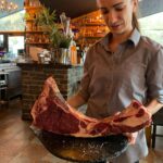 ¡Qué emocionante que hayáis visitado Andorra! 😊 Es un país con una belleza natural impresionante y una rica tradición gastronómica. El Restaurant La Sangría Grill suena como un lugar increíble para los amantes de la carne. Aquí tienes más detalles sobre este restaurante: Nombre: Restaurant La Sangría Grill Especialidad: Txuletones y carnes prémium XXXXL Ubicación: En la Carretera General, cerca de la rotonda de acceso al Santuario de Meritxell en Canillo. Los Chuletones son chuletas de carne de vacuno, típicas del País Vasco y Navarra. Se caracterizan por su gran tamaño y su sabor intenso. Si os gustan las carnes jugosas y sabrosas, seguro que disfrutasteis de una experiencia culinaria memorable en La Sangría Grill. Además, me alegra saber que seguís a @AndorraLovers. ¿Hay algún otro lugar o restaurante que hayáis descubierto durante vuestro viaje? Si tenéis más recomendaciones o si necesitáis información adicional sobre Andorra, no dudéis en preguntar. ¡Estoy aquí para ayudar! 😊🍽️ Havíem sentit molt a parlar del restaurant La Sangria Grill a Meritxell direcció Canillo i ja entenem el perquè. Restaurant La Sangria Grill esta situat a Meritxell, a uns 20 minuts d'Andorra la Vella. Està especialitzat en carn a la brasa a l'estil francès, de mida XXXXL, hi podeu trobar tomahawok o baveta de bou de diferents mides, la ració més petita es increiblement gran. Però la carta és molt variada i podeu trobar tota mena de plats típics de muntanya, i alguns de gastronomia francesa com fondues. Vam menjar molt i no ens va quedar gana per les postres, però diuen que s'han de provar les creps casilanes que fan. Si sou amants de la bona i millor carn, La Sangria Grill REstaurant és l'ideal per vosaltres! El plat més popular al Restaurant La Sangria Grill és, sens dubte, la carn a la brasa. Amb la seva especialització en carn a l’estil francès, és el lloc ideal per als amants de la bona i millor carn. Els tomahawks i les bavettes de bou són opcions delicioses, i la mida XXXXL de les racions segurament satisfarà fins i tot els més famolencs. A més, si us agraden els plats típics de muntanya i la gastronomia francesa, també podeu gaudir de fondues i altres opcions delicioses. I no oblideu deixar espai per les creps casolanes per a les postres! 😊 Si teniu més dubtes o necessiteu més informació, no dubteu a preguntar! 🍽️ Aquest cap de setmana hem estat a 📌 #Andorra al Restaurant La Sangria Grill a Meritxell on mana la cuina de muntanya🏔 amb plats molt abundants i les brases🔥 com a protagonistes a la cuina. Amb aquest escenari, vam decidir anar forts i anar a menjar un autèntic Xuleton de bou🥩 per dues persones només apte per carnívors amb gana😂 El restaurant escollit per fer aquest tros d’àpat va ser @lasangriacanillo, un local acollidor a les portes del Santuari de Meritxell. El mestre braser domina el foc amb mestratge👌🏻. Ens van servir el Xuleton XXXXL amb patates, verdura i acompanyat de 4 salses😍: pebre, ceps, formatge blau i all i julivert, d'escàndol😋, senzillament meravellós. Com que som uns temeraris, no vam poder evitar partir-nos un camembert🧀 fos al forn d’entrant🙊. Deliciós! Tot i que prescindible si haguéssim sabut el que ens venia després🤣 🍷: un vi negre Ales Negres de l’Empordà del celler @terraremota 100% garnatxa negra que va ser el company de festa pel festival de carn. #foodielophia #foodporn #foodie #andorrafoodie #instafood #foodart #instagood #chuletón #txuletón #meat #meatlovers #lasangriagrill #lasangria #andorra #andorre #meritxell #canillo #restaurantesandorra #andorrarestaurantes Sembla que heu tingut una experiència gastronòmica increïble al Restaurant La Sangria Grill! El fet que el restaurant estigui situat a Meritxell, prop del Santuari de Meritxell, li dona un toc especial. I, per descomptat, la carn a la brasa és la protagonista indiscutible. El Xuleton de bou que vau demanar sembla una autèntica festa per als amants de la carn. Amb les patates, la verdura i les 4 salses (pebre, ceps, formatge blau i all i julivert), segurament va ser una experiència deliciosa. I no puc evitar somriure amb la vostra descripció del camembert al forn d’entrant. A vegades, les sorpreses culinàries són les millors! El vi negre Ales Negres de l’Empordà sembla una excel·lent elecció per acompanyar aquest festival de carn. La garnatxa negra segurament va realçar els sabors i va fer que l’àpat fos encara més memorable. Gràcies per compartir aquesta història amb mi! Si teniu més dubtes o necessiteu més recomanacions, no dubteu a preguntar. Bon profit! 🍽️🔥🍷 ¡El nombre de este restaurante no hace justicia a lo BIEN que se come allí, y es que además, tienen opciones #singluten en muchos de sus platos! 🌾 En mi caso me pedí de primero un queso Camembert fundido con miel, nueces y pasas y el pan que lo acompañaba era #singluten 🍞 ¡Sus especialidades son las carnes 🤤 así que si sois amantes de la comida de montaña, os recomiendo ir a este restaurante en Andorra! Pd: lo único que me decepcionó un poco es que no tenían cerveza #singluten 🍺 ¡De todas formas se lo comenté así que quizás para la próxima ya tengan! 🚀 #singluten #glutenfree #glutenfreebarcelona #singlutenbarcelona #celiacos #celiacs #celiacosespaña #celiacscatalunya #sensegluten #senseglutenbarcelona #senseglutenandorra #singlutenandorra Weekend in Andorra! We have decided to spend some days in Andorra and it was really relaxing and good to recharge our batteries! We have tried to find new restaurants and @lasangriacanillo has been a really good surprise. Very nice service, high quality food and a really good Portuguese wine from @adegamayor Reserva 2018. Rated in @vivino with 4.2 (we always use this app to support us in choosing the wine) was really a good surprise! Very acceptable price and really good quality. We truly recommend it! #andorra #ski #andorrarestaurants #lasangriacanillo #adegamayor #portuguesewine #alentejo #foodtravelandllove